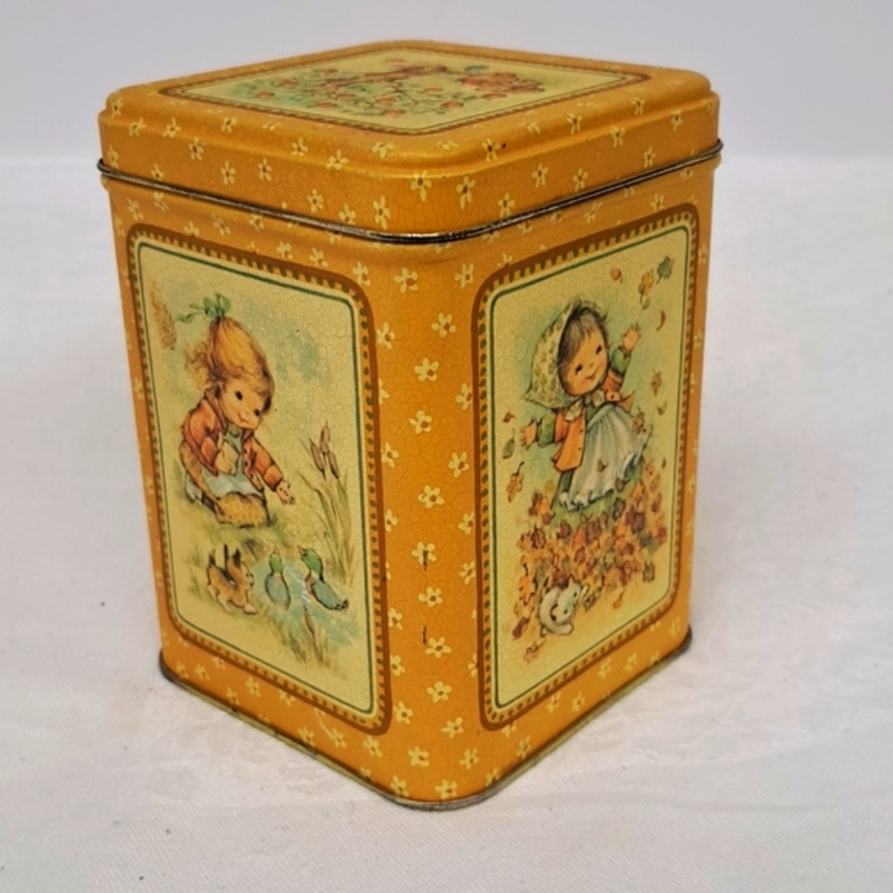 Vintage lidded tin with images of young girls in the four seasons by HALLMARK
